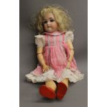 A large 19th century Simon and Halbig bisque headed doll. 59 cm tall.