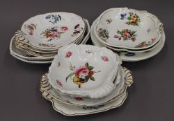 A quantity of florally painted 19th century porcelain, some Crown Derby, some possibly Coalport.