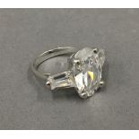 A silver three stone cubic zirconia ring