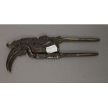 An Indonesian betel nut cutter formed as a hornbill. 21 cm long.