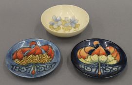 A Moorcroft bowl and two small modern Moorcroft dishes. The former 11.5 cm diameter.