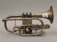 A Bigham silver plated cornet. 32 cm long.