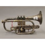 A Bigham silver plated cornet. 32 cm long.