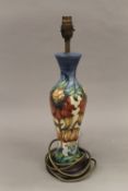 A Moorcroft Anna Lily table lamp by Nicola Slaney with matching silk shade.