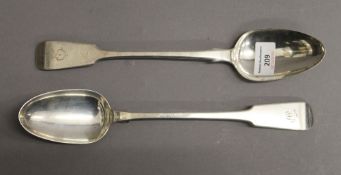 Two Georgian silver basting spoons. Each 30.5 cm long. 9.2 troy ounces.