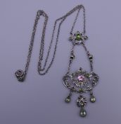 A vintage French silver marcasite, green and pink paste stone pendant. The pendant 6.5 cm high.
