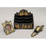 A chinoiserie lacquered letter rack, a wall pocket and a pocket watch holder. The former 16.
