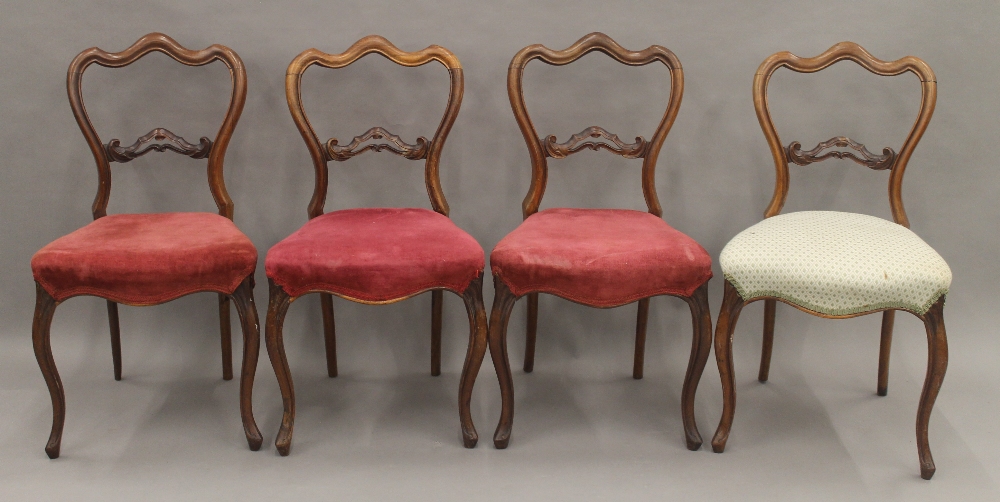 A set of four Victorian rosewood dining chairs