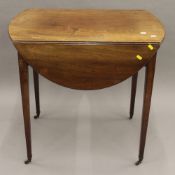 A 19th century mahogany Pembroke table. 51 cm wide flaps down.