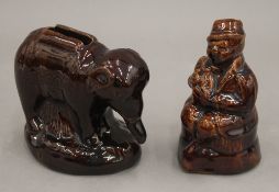 Two 19th century treacle glazed money boxes, one formed as an elephant, 11 cm long.