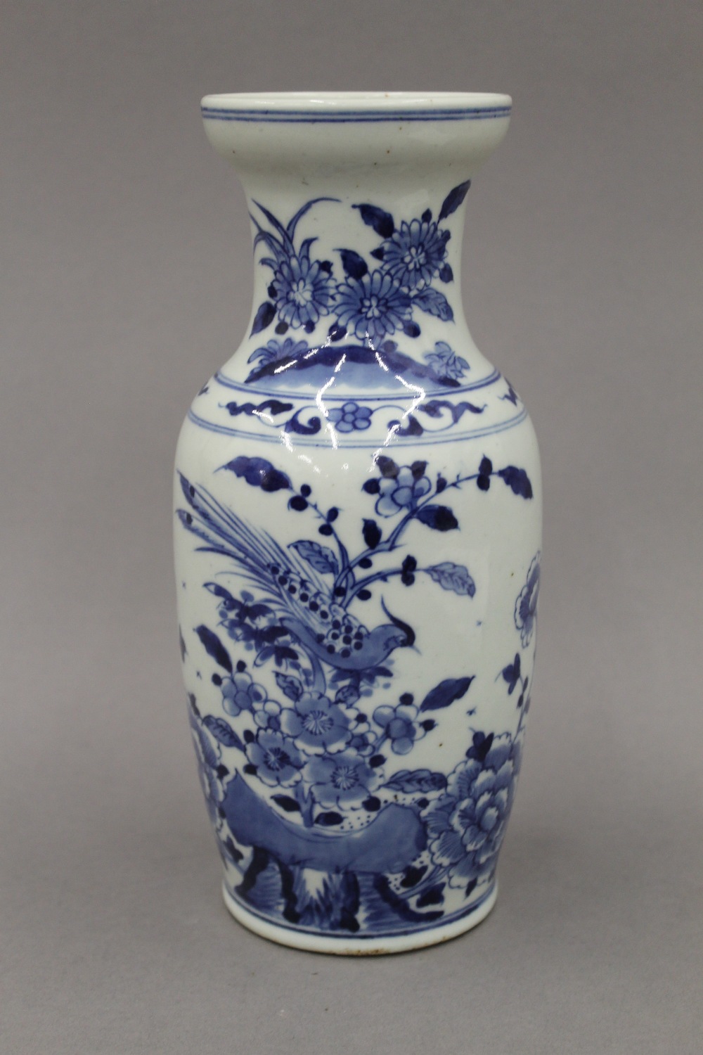 A 19th century Chinese blue and white porcelain vase, decorated with birds, flowers and rockwork. - Image 2 of 3