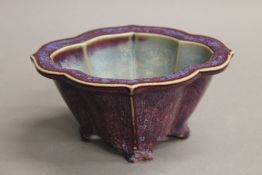 A Chinese purple ground porcelain censer. 16.5 cm wide.