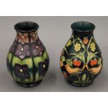 Two small modern Moorcroft bulbous vases. each approximately 13.5 cm high.