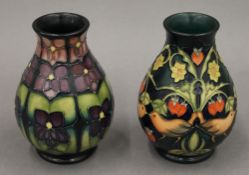 Two small modern Moorcroft bulbous vases. each approximately 13.5 cm high.