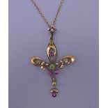 An Art Nouveau 9 ct gold pendant on a 9 ct gold chain. 4.5 cm high. 4.2 grammes total weight.