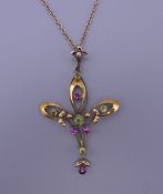 An Art Nouveau 9 ct gold pendant on a 9 ct gold chain. 4.5 cm high. 4.2 grammes total weight.