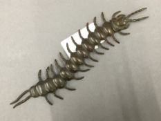 An articulated bronze model of a centipede. 15 cm long.