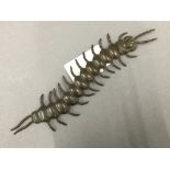 An articulated bronze model of a centipede. 15 cm long.