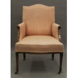 An Edwardian upholstered armchair. 60 cm wide.