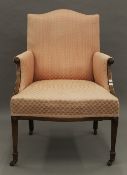 An Edwardian upholstered armchair. 60 cm wide.