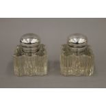 A pair of cut glass inkwells. 8.5 cm high.