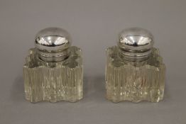 A pair of cut glass inkwells. 8.5 cm high.