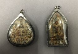 Two Asian icon pendants. The largest 7 cm high.