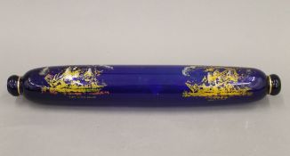 A Victorian Bristol blue glass rolling pin, decorated with ships. 38 cm long.