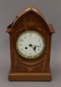 An Edwardian inlaid mantle clock. 33 cm high.