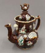 A large Edwardian pottery Barge tea pot. 32.5 cm high.