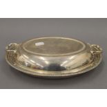 A silver entree dish. 28 cm wide. 31.2 troy ounces.