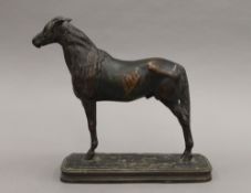 EMMANUEL FREMIET (1824-1910) French, a patinated bronze animalier sculpture of a stallion, signed.