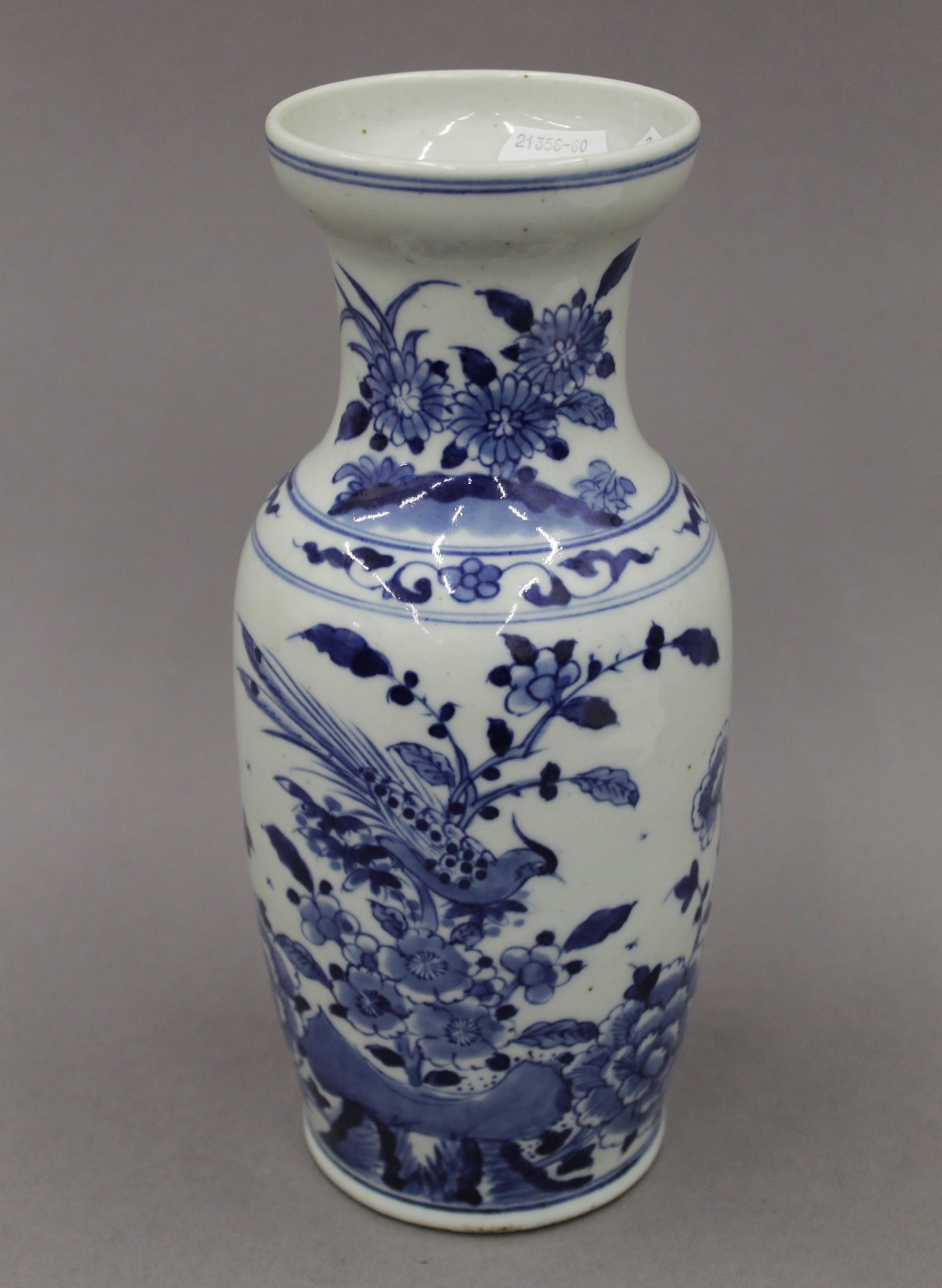 A 19th century Chinese blue and white porcelain vase, decorated with birds, flowers and rockwork.