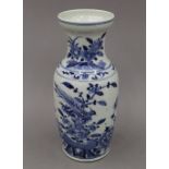 A 19th century Chinese blue and white porcelain vase, decorated with birds, flowers and rockwork.