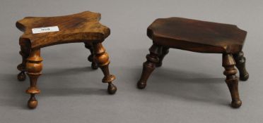 Two 19th century turned wooden candle stands. The largest 10.5 cm high.
