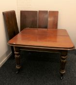 A Victorian mahogany four leaf extending dining table. 125.5 cm wide x 191 cm long.