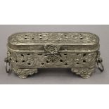 An Afghan white metal box with hinged lid with clasp, tooled open work. 16 cm long.