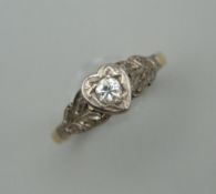 An unmarked, probably 18 ct gold diamond solitaire ring. Ring size H/I.