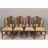 A set of eight early 20th century shield back dining chairs