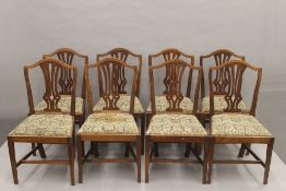 A set of eight early 20th century shield back dining chairs