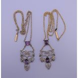 Two Edwardian gold, silver, amethyst and seed pearl pendants, in glass Victorian case.