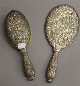 A Tiffany & Co sterling silver mirror and brush. The former 27 cm long. 16.