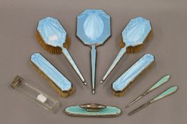 A quantity of enamel decorated silver dressing table wares. The largest 31 cm long.