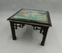 A Chinese coffee table. 61 cm wide.