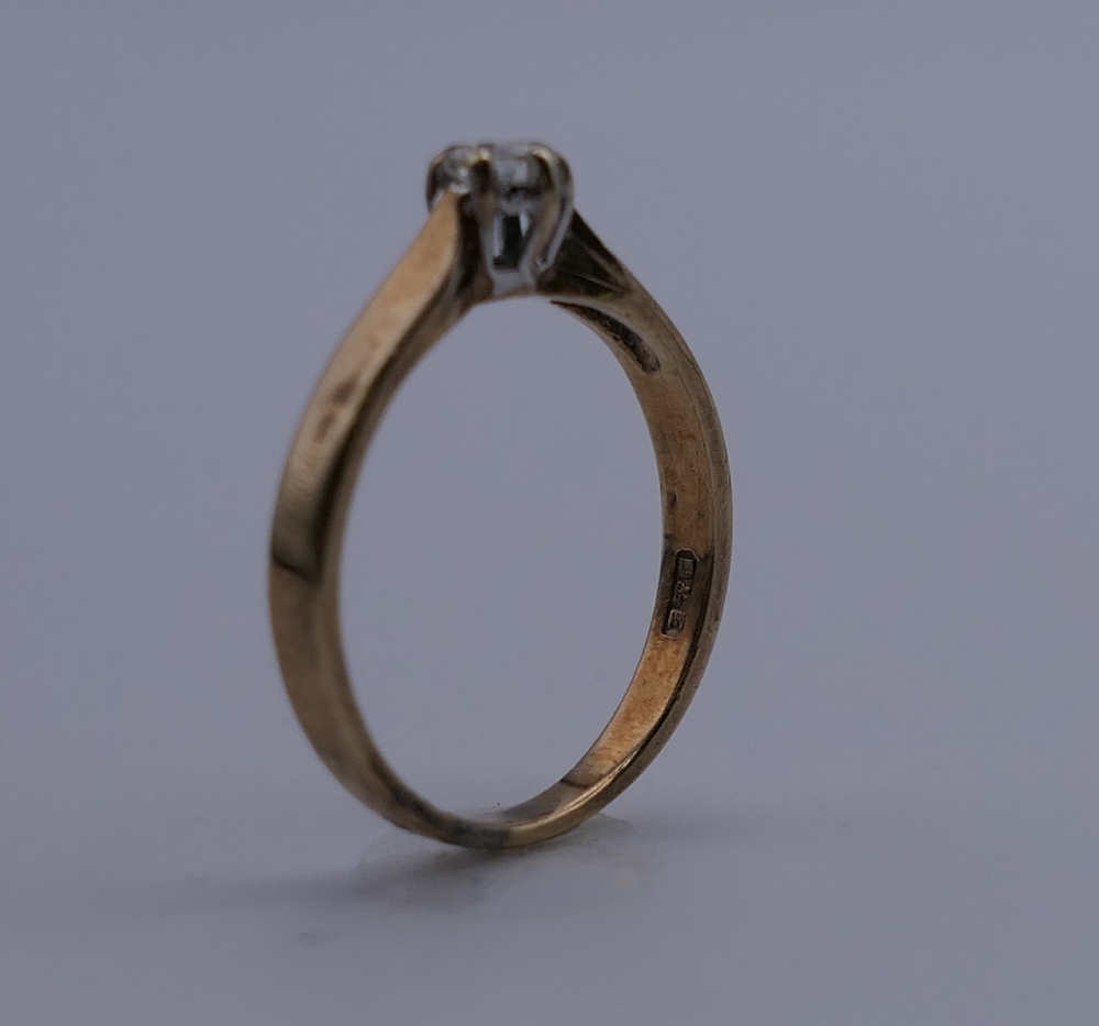 A 9 ct gold diamond solitaire ring. Ring size J. 1.4 grammes total weight. - Image 3 of 5
