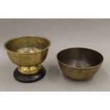 Two Eastern brass bowls, one with engraved decoration.