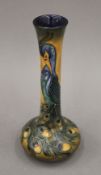 A modern Moorcroft Peacock Feather pattern vase. 20 cm high.