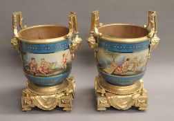 A pair of gilt metal mounted porcelain cache pots. 33 cm high.