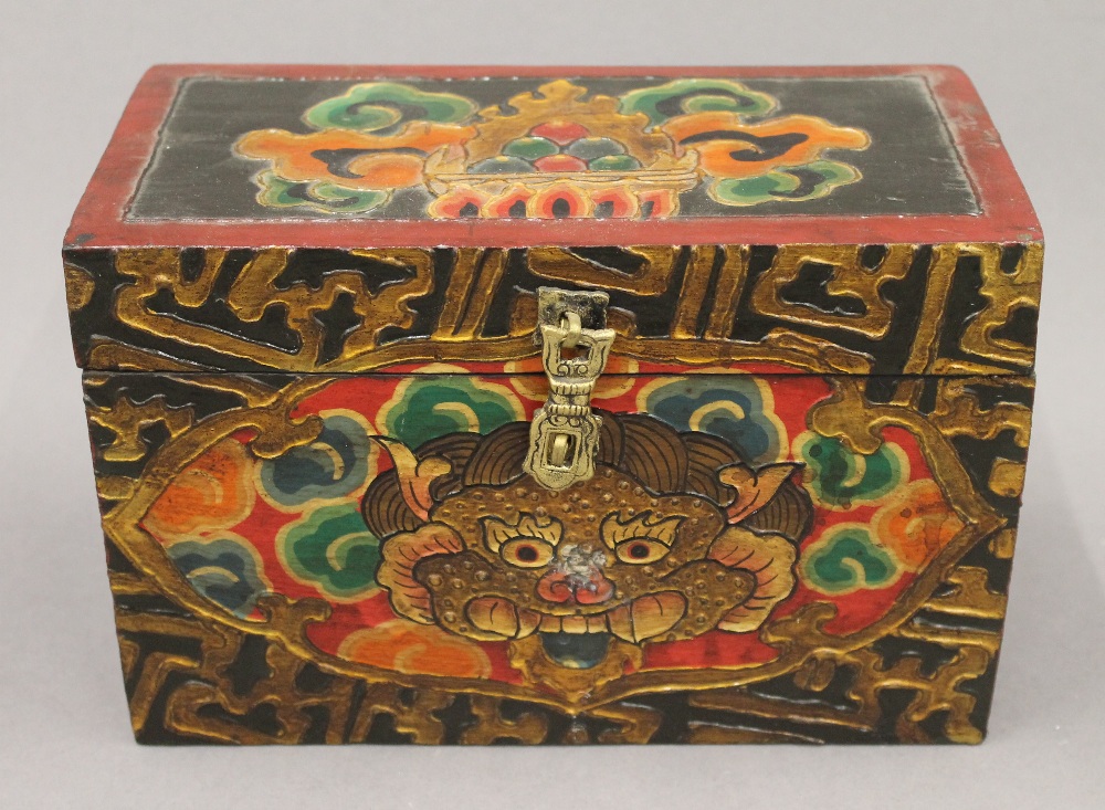 A hand painted Tibetan box. 23 cm wide.