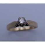 A 9 ct gold diamond solitaire ring. Ring size K/L. 2 grammes total weight.